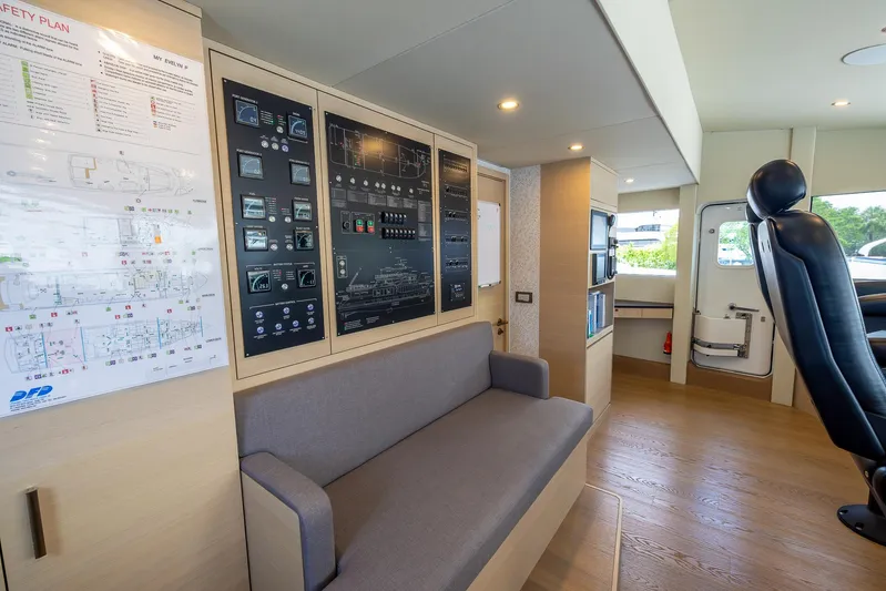 Evelyn P Yacht Photos Pics Interior of 2022 Numarine 37XP yacht with control panels and seating area.