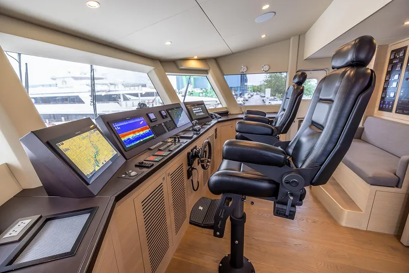 Evelyn P Yacht Photos Pics Bridge interior of 2022 Numarine 37XP yacht with modern navigation equipment.