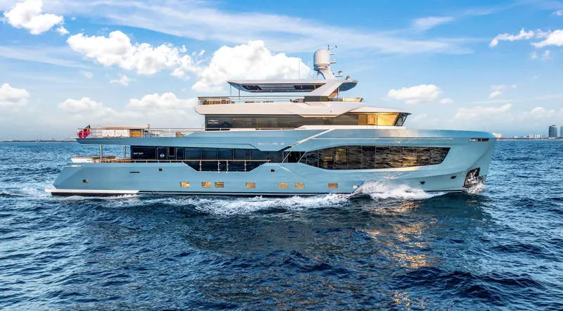 Evelyn P Yacht Photos Pics Luxurious 2022 Numarine 37XP yacht cruising on open sea under clear blue sky.