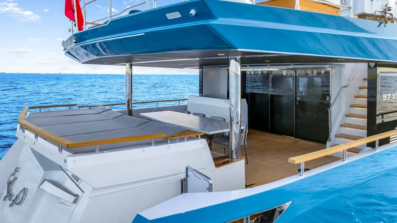 Evelyn P Yacht Photos Pics Luxury Numarine 37XP yacht, 2022 model, featuring spacious deck and modern design on open sea.