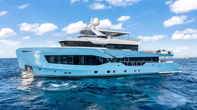 Evelyn P Yacht Photos Pics Luxury 2022 Numarine 37XP yacht cruising on open sea under blue sky.