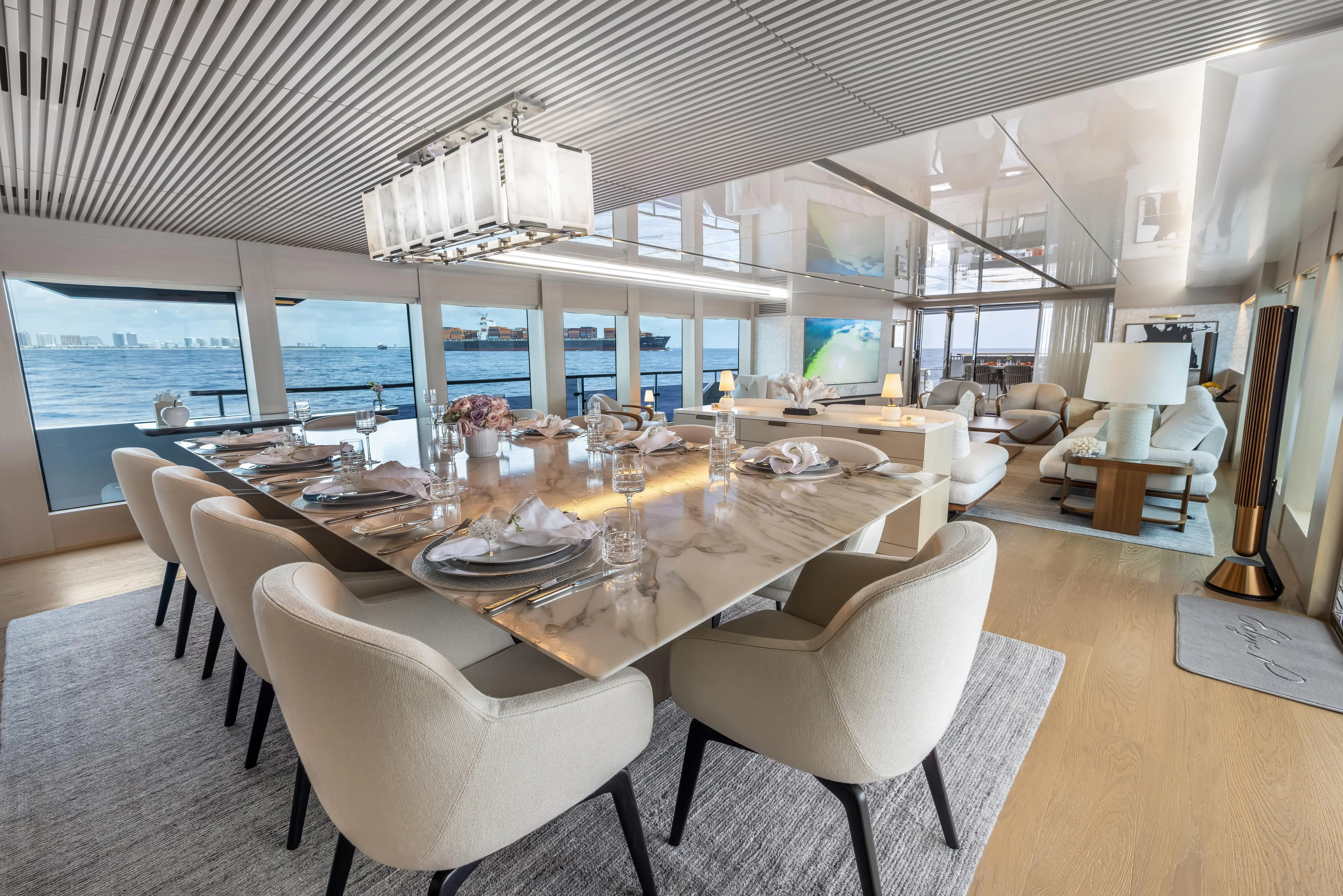 Evelyn P Yacht Photos Pics Luxurious dining area on 2022 Numarine 37XP yacht with ocean view and elegant decor.