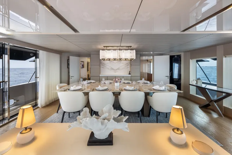 Evelyn P Yacht Photos Pics Luxurious dining area on 2022 Numarine 37XP yacht with elegant decor and ocean view.