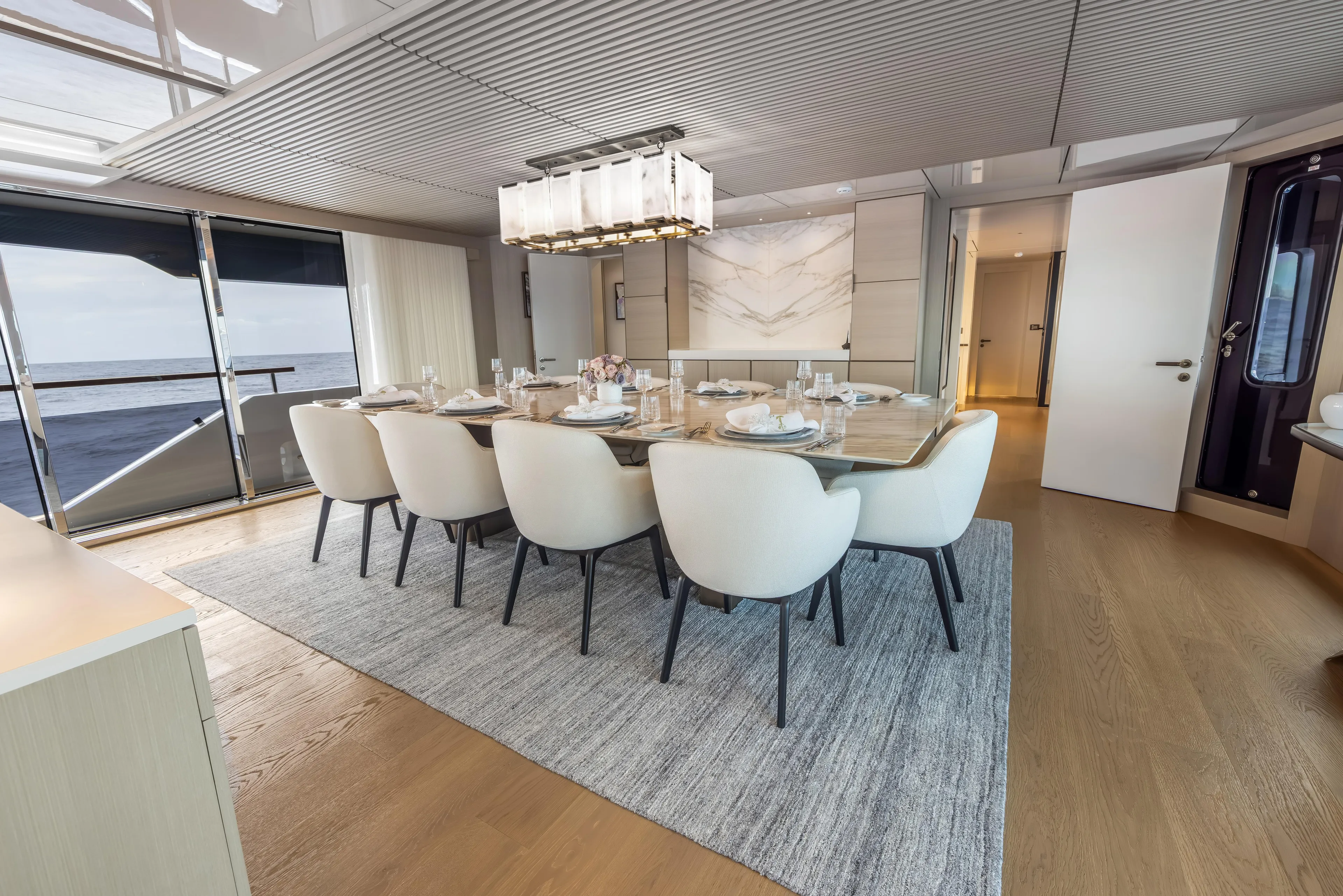 Evelyn P Yacht Photos Pics Luxurious dining area on 2022 Numarine 37XP yacht with elegant decor and ocean view.