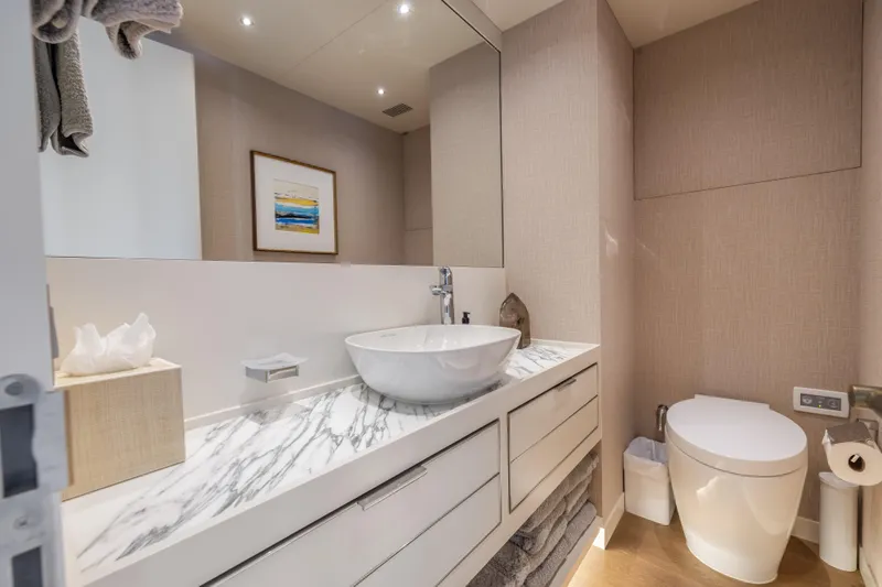 Evelyn P Yacht Photos Pics Luxurious bathroom on 2022 Numarine 37XP yacht with marble countertop and modern fixtures.