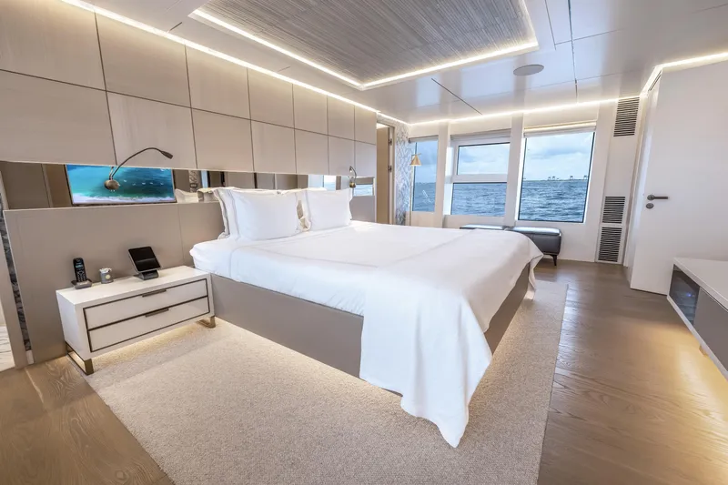 Evelyn P Yacht Photos Pics Luxurious bedroom interior on 2022 Numarine 37XP yacht with ocean view.