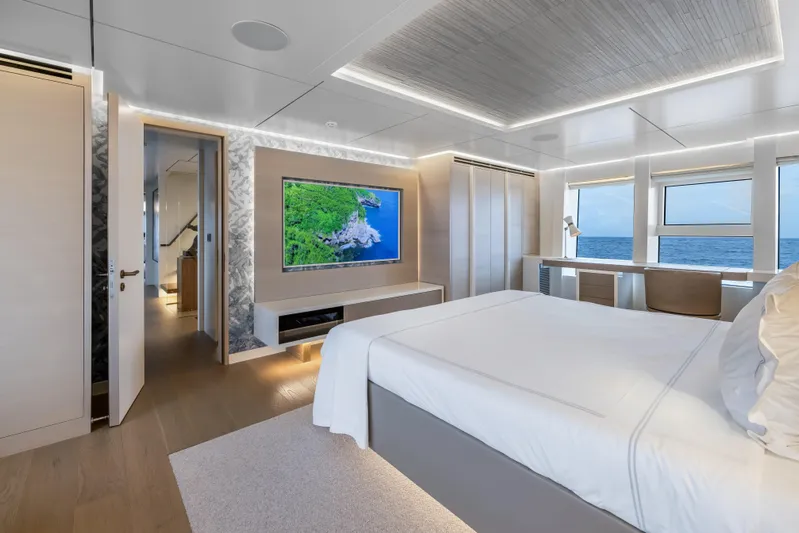 Evelyn P Yacht Photos Pics Luxurious bedroom interior on 2022 Numarine 37XP yacht with ocean view and modern decor.