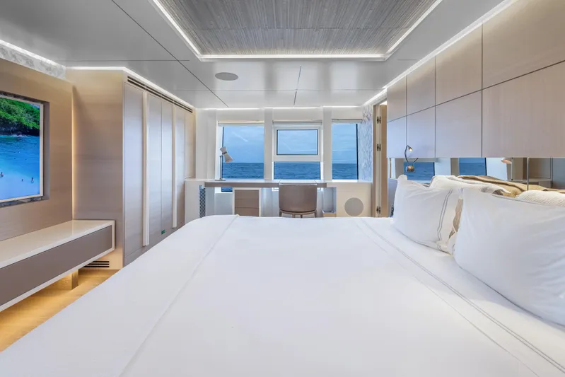 Evelyn P Yacht Photos Pics Luxurious bedroom interior of 2022 Numarine 37XP yacht with ocean view.