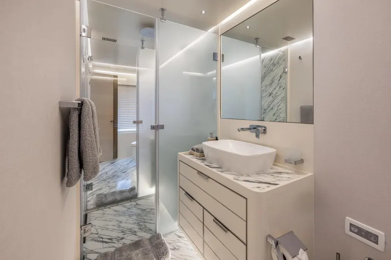 Evelyn P Yacht Photos Pics Luxurious bathroom in 2022 Numarine 37XP yacht with marble accents and modern fixtures.