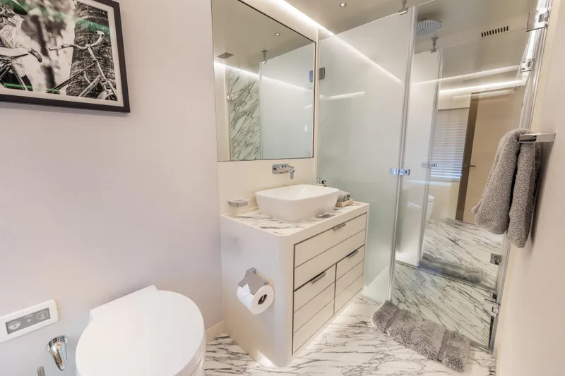 Evelyn P Yacht Photos Pics Luxurious bathroom in 2022 Numarine 37XP yacht with modern fixtures and marble accents.