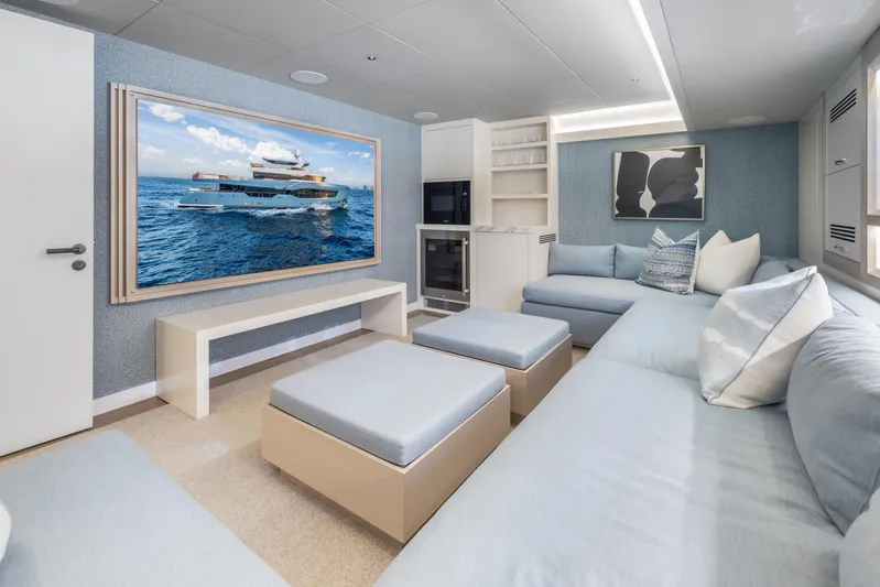 Evelyn P Yacht Photos Pics Luxurious interior of 2022 Numarine 37XP yacht with modern seating and large wall art.