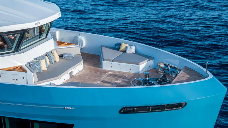 Evelyn P Yacht Photos Pics Luxurious 2022 Numarine 37XP yacht with elegant deck seating on the ocean.