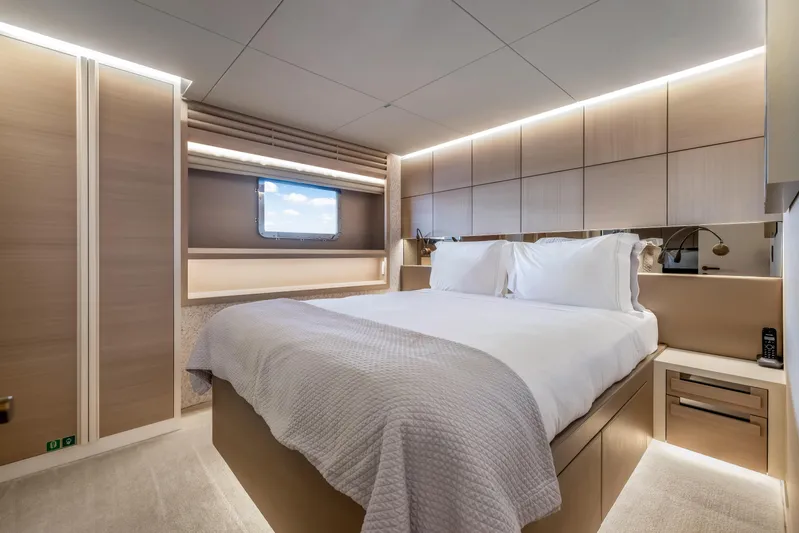 Evelyn P Yacht Photos Pics Luxurious bedroom interior of 2022 Numarine 37XP yacht with modern design and ambient lighting.