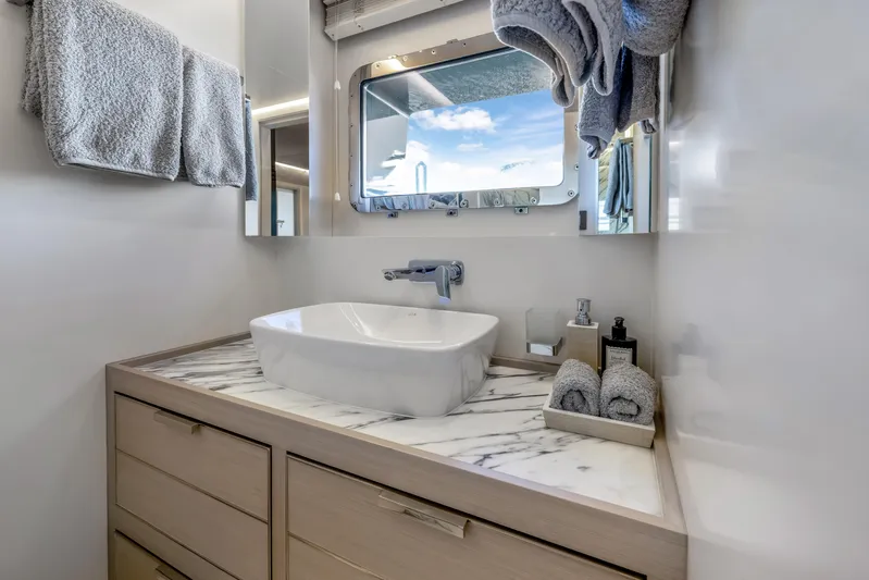 Evelyn P Yacht Photos Pics Luxurious bathroom in 2022 Numarine 37XP yacht with marble countertop and modern fixtures.