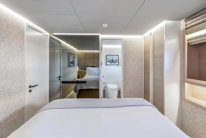 Evelyn P Yacht Photos Pics Luxurious bedroom interior of 2022 Numarine 37XP yacht, featuring modern design and elegant lighting.
