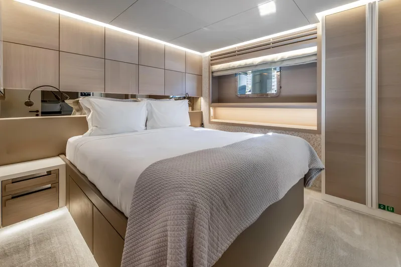 Evelyn P Yacht Photos Pics Luxurious bedroom interior of 2022 Numarine 37XP yacht with modern design and ambient lighting.