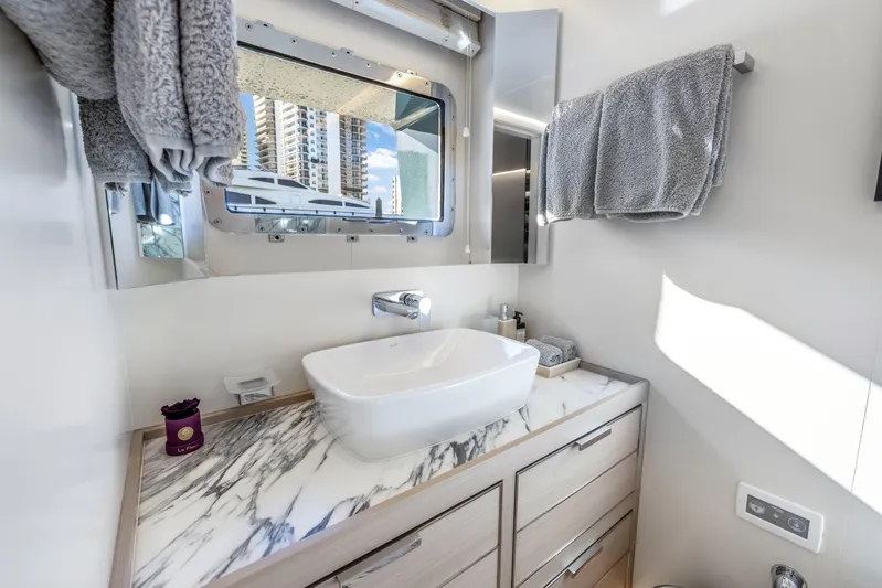 Evelyn P Yacht Photos Pics Luxurious bathroom in 2022 Numarine 37XP yacht with marble countertop and modern fixtures.