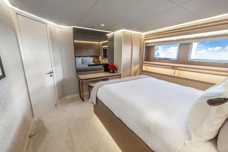 Evelyn P Yacht Photos Pics Luxurious bedroom interior of 2022 Numarine 37XP yacht with modern design and ocean view.