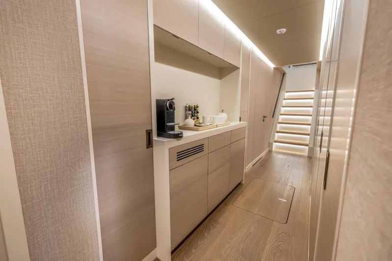 Evelyn P Yacht Photos Pics Luxurious interior of 2022 Numarine 37XP yacht with modern kitchenette and elegant lighting.