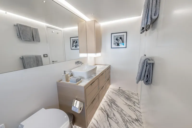 Evelyn P Yacht Photos Pics Luxurious bathroom in 2022 Numarine 37XP yacht with modern fixtures and elegant design.