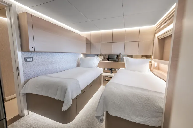 Evelyn P Yacht Photos Pics Luxurious twin bedroom in 2022 Numarine 37XP yacht, featuring modern design and ambient lighting.