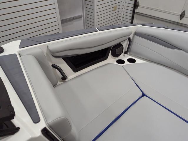 2025 Axis A225 boat interior with gray seating and cup holders.