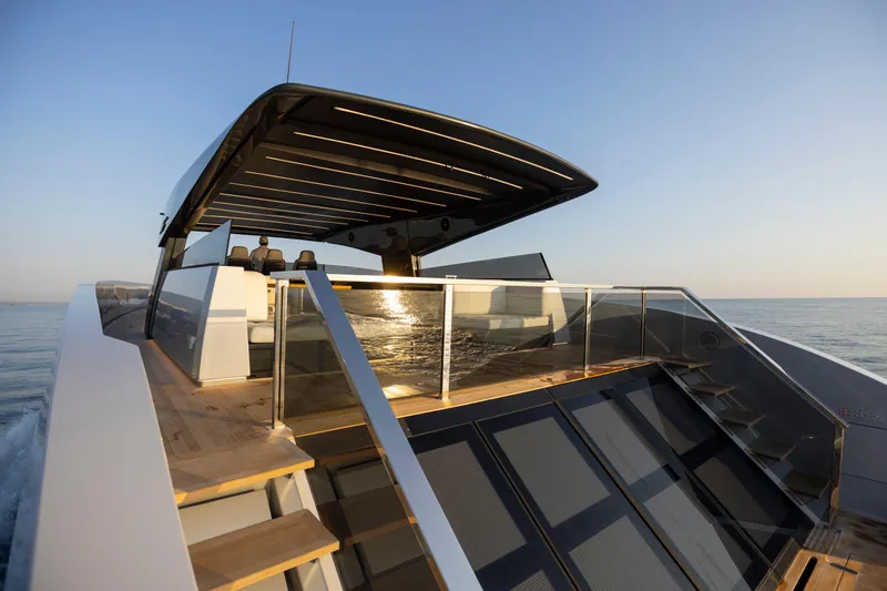  Yacht Photos Pics Luxury MandaYachts 07 SPIDER 2025 model cruising on open water at sunset.