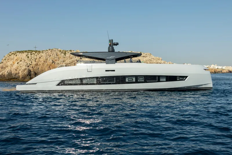  Yacht Photos Pics Futuristic 2025 MandaYachts 07 SPIDER cruising near rocky coastline.