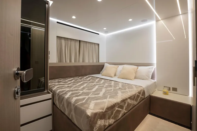  Yacht Photos Pics Luxurious bedroom interior of 2025 MandaYachts 07 SPIDER with modern design and ambient lighting.