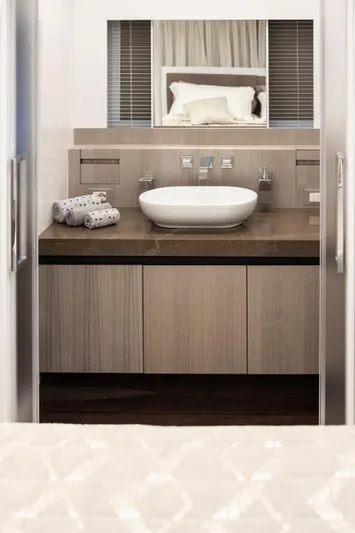  Yacht Photos Pics Luxury yacht bathroom with modern sink and wooden cabinetry, MandaYachts 07 SPIDER 2025 model.