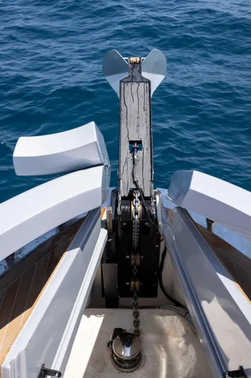  Yacht Photos Pics Bow view of 2025 MandaYachts 07 SPIDER, showcasing anchor mechanism over blue ocean.