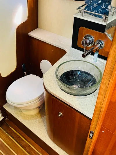 Why Knot Yacht Photos Pics 2007 Tiara Yachts 3900 Sovran bathroom with modern sink and toilet.