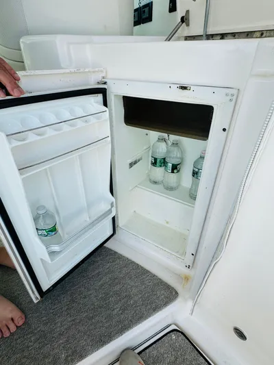 Why Knot Yacht Photos Pics Mini fridge on 2007 Tiara Yachts 3900 Sovran with bottled water.