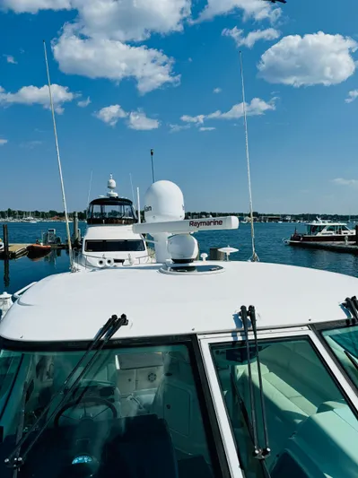 Why Knot Yacht Photos Pics 2007 Tiara Yachts 3900 Sovran docked at a marina on a sunny day.