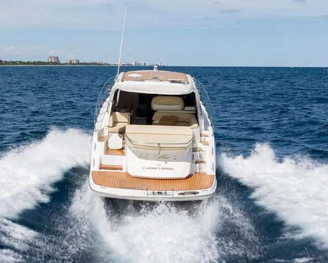 She Is Royal Yacht Photos Pics 2014 Cranchi M 44 HT yacht cruising on open water, rear view.