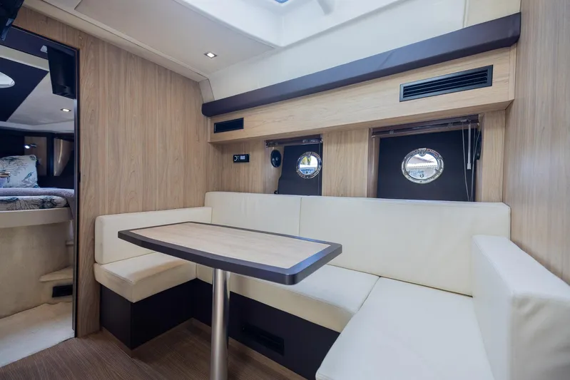 She Is Royal Yacht Photos Pics Interior of 2014 Cranchi M 44 HT yacht with modern seating and portholes.
