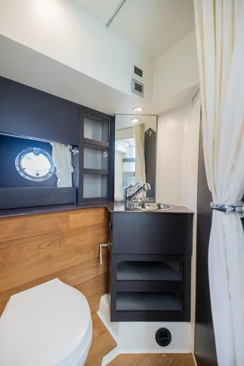 She Is Royal Yacht Photos Pics Luxurious bathroom interior of 2014 Cranchi M 44 HT yacht with modern fixtures.
