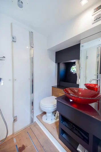 She Is Royal Yacht Photos Pics Luxurious bathroom in 2014 Cranchi M 44 HT yacht with modern fixtures and red glass sink.