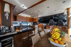  Yacht Photos Pics Luxurious interior of 2015 Sunseeker 75 yacht with modern kitchen and fruit display.