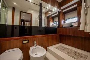  Yacht Photos Pics Luxurious bathroom interior of 2015 Sunseeker 75 yacht with modern fixtures.