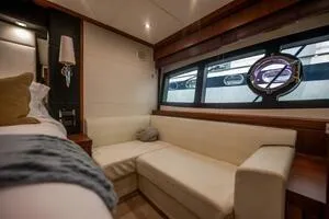  Yacht Photos Pics Luxurious interior of 2015 Sunseeker 75 yacht with elegant seating and large windows.