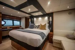  Yacht Photos Pics Luxurious bedroom interior of a 2015 Sunseeker 75 yacht with elegant furnishings.