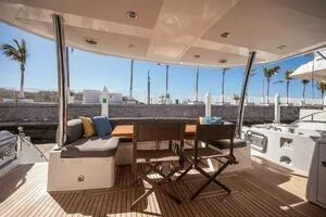  Yacht Photos Pics Luxury Sunseeker 75 yacht deck with seating, 2015 model, palm trees in background.