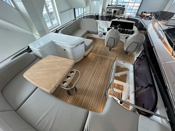 F45110 Yacht Photos Pics Luxurious 2024 Princess F45 yacht interior with sleek seating and modern helm.