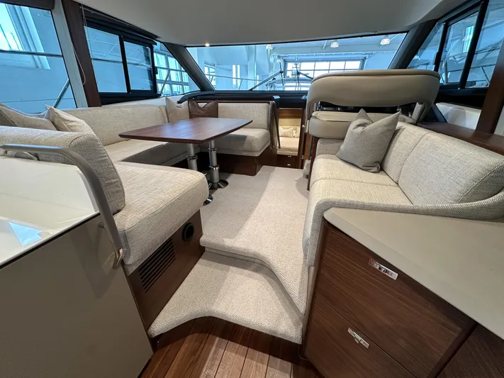 F45110 Yacht Photos Pics Luxurious interior of 2024 Princess F45 yacht with elegant seating and wooden accents.
