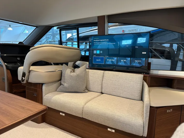 F45110 Yacht Photos Pics Luxurious interior of 2024 Princess F45 yacht with plush seating and modern entertainment system.