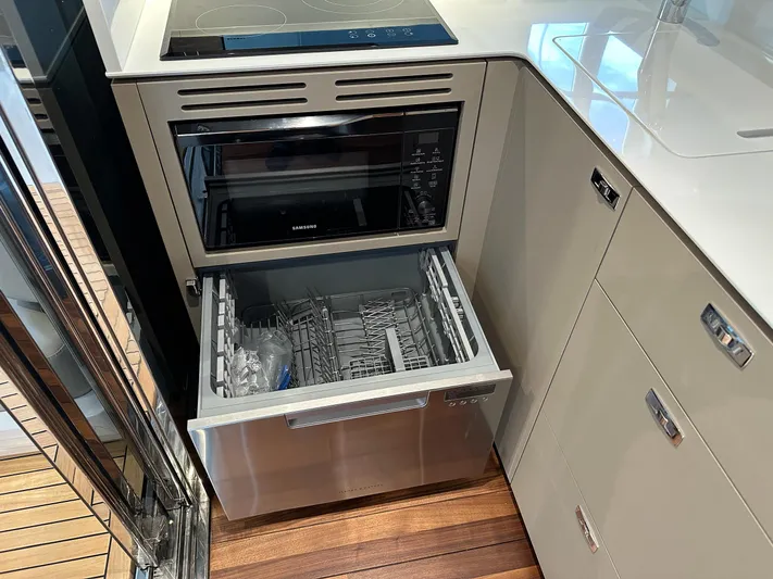 F45110 Yacht Photos Pics Modern kitchen with built-in appliances on a 2024 Princess F45 yacht.