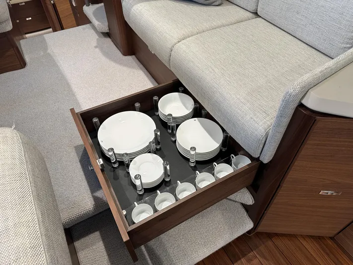 F45110 Yacht Photos Pics Drawer with neatly organized dishes in a 2024 Princess F45 yacht interior.