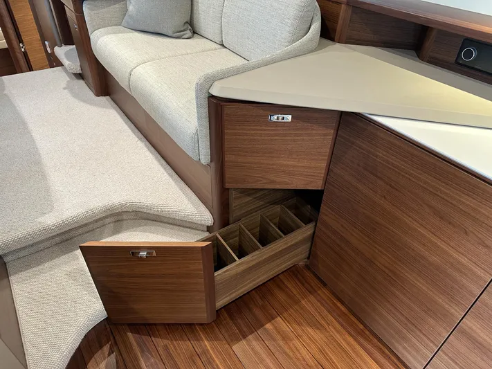 F45110 Yacht Photos Pics Luxurious 2024 Princess F45 yacht interior with elegant wood cabinetry and plush seating.