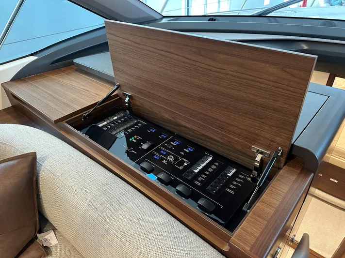 F45110 Yacht Photos Pics 2024 Princess F45 yacht control panel with wooden cover, showcasing modern design and functionality.